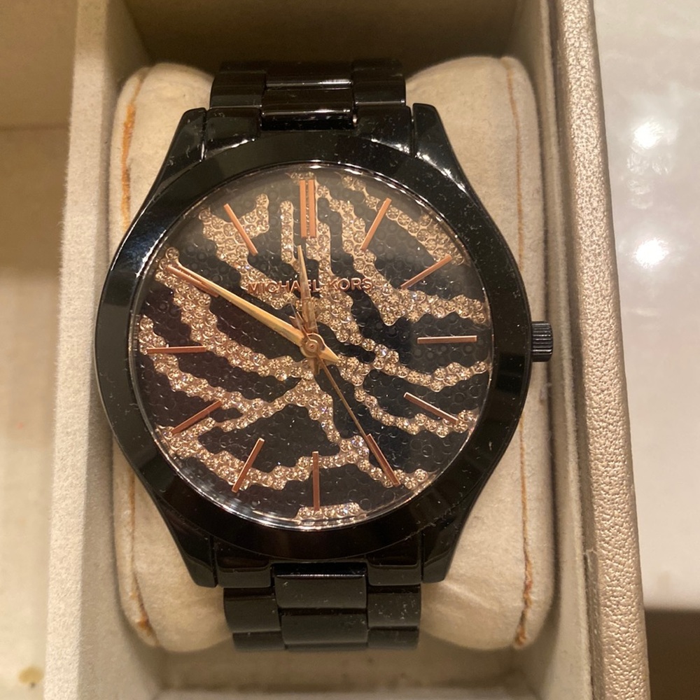 Black Michael Kors watch with cheetah face